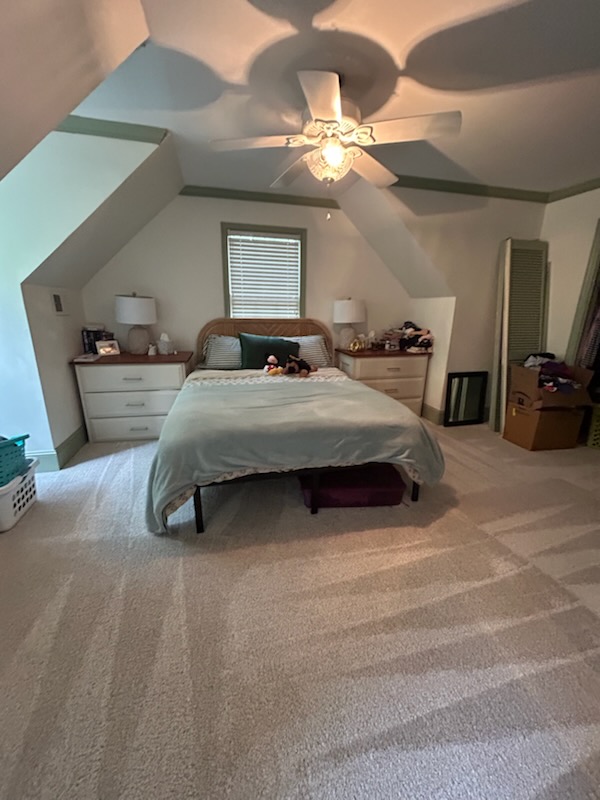 Neatly made bedroom after cleaning